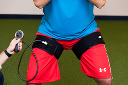 a man holding a tennis racquet on top of a tennis court.