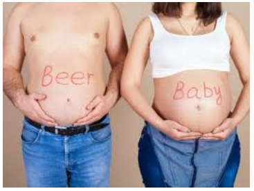 a man and a woman holding their stomachs with the words beer written on them.