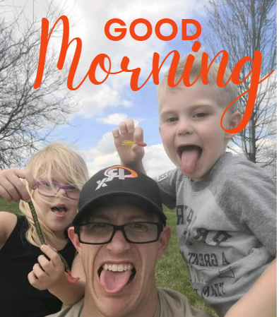 a man and two children posing for a picture.