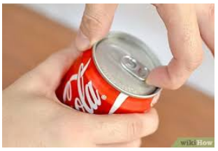 a person opening a can of coca cola.