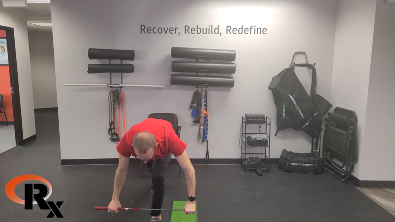 a man doing push ups in a gym.