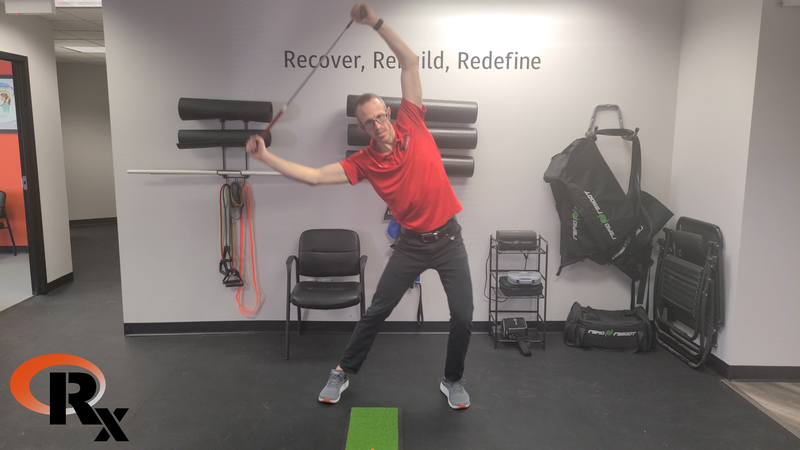 a man in a red shirt is doing exercises in a gym.