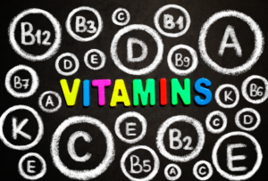 A chalkboard with the word vitamins written on it.